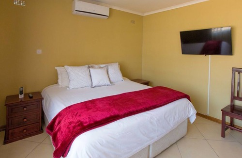 Harare House | 2 Bed roomed fully furnished and secure apartment,very close to shopping center.