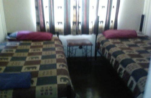 Victoria Falls Cabin | Cheetah room accommodating two