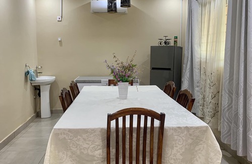 Lusaka Cottage | Cozy, quiet and beautiful two bedroom gated cottage. Full kitchen & pool access.