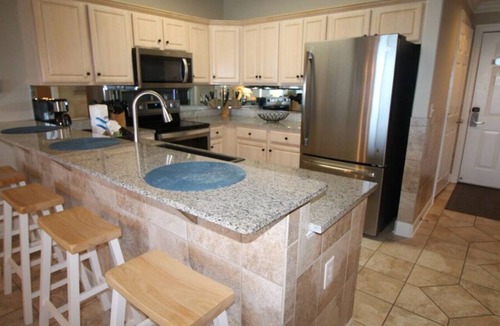 West Panama City Beach Condo | Emerald Isle 1006 - Front row beach chair service included! Affordable rates!