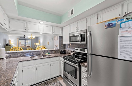 Myrtle Beach Condo | Enjoy the breeze from the screened in porch on summer nights at Summertree Villa