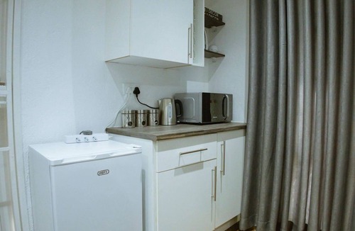 Harare Apartment | Harare Deluxe Homes- Grey-Suite Self contained studio with workspace and wifi