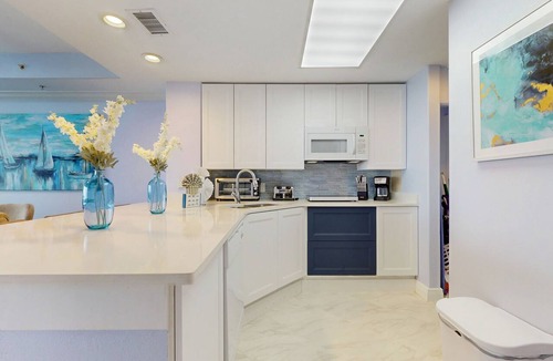 Florida Central Atlantic Coast Condo | Lakefront retreat near attractions with lake view, AC, WiFi, pool, hot tub & gym