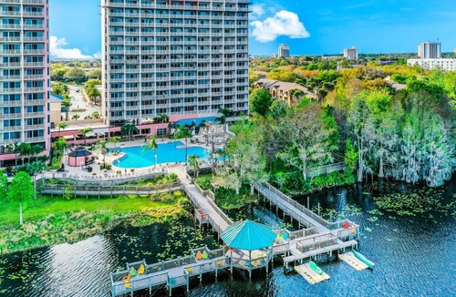 Florida Central Atlantic Coast Condo | Lakefront retreat near attractions with lake view, AC, WiFi, pool, hot tub & gym