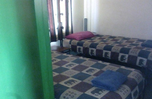 Victoria Falls Cabin | Lion Room with one bed one bath