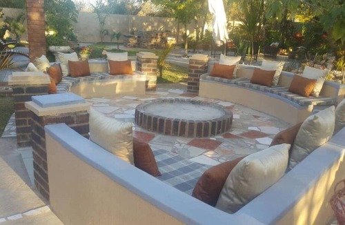 Kwekwe House | Palm and rose garden, golden acres