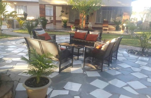 Kwekwe House | Palm and rose garden, golden acres