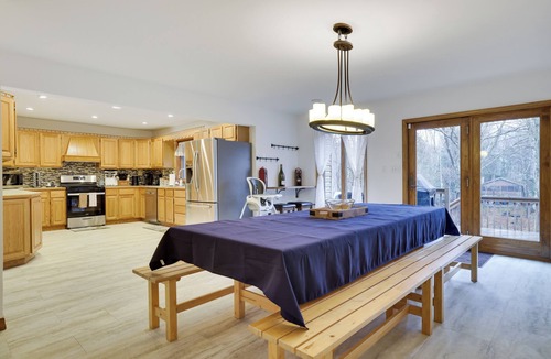 Pocono Lake House | Spacious Creek Front 6-bedroom home-Lake/Pool/Kayaks/Hot Tub/Game Rm/Fire Pit.