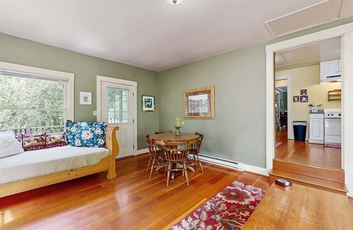 Molalla House | Tranquil landscape with riverside firepit, gas grill, gas fireplace, and deck