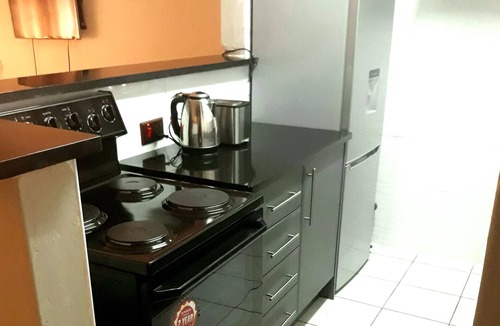 Harare Apartment | Upscale and Urban Warm Tasteful 1 Bed Apartment.