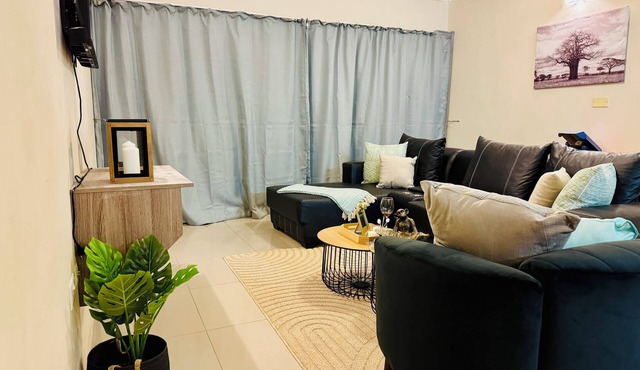 Cozy 2-bedroom apartment in the busy city of Gaborone with WiFi and A/C