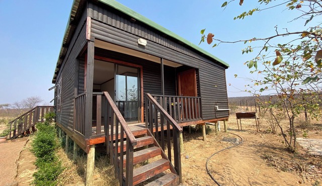 Cozy wooden cabin overlooking the foot of the Tswapong Hills in Palapye.
