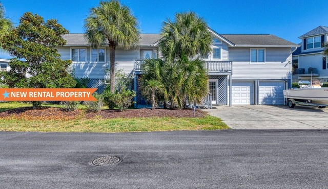 Five Bedroom Home with a Private Pool on the Channel and Pet Friendly
