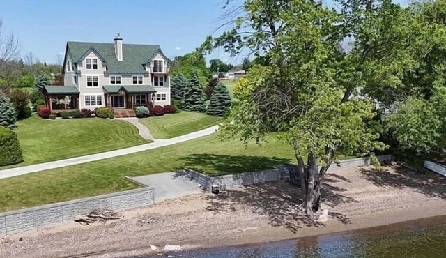 Stunning lakefront estate-sandy beach-family friendly-private dock-large lawn